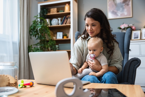 Mother and baby looking a computer screen