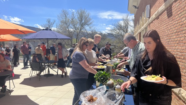 Staff enjoy a lunch on the library terrace